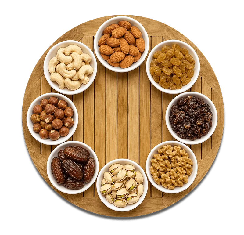 Assorted premium dry fruits and nuts arranged on a wooden tray